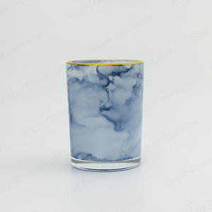 蓝色大理石玻璃蜡烛罐，带金色边缘