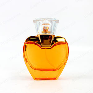 Hot Sale Heart Shape Yellow Glass Perfume Bottle With Spray Pump And Cap