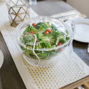 Multifunctional Chilled salad bowl on ice with spoon and fork 