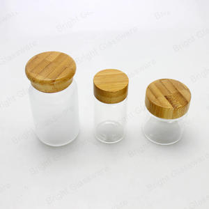 Pot de luxe en verre dépoli clair vide avec couvercle en bambou pot cosmétique avec bouchon en bambou à vis pour les soins de la peau