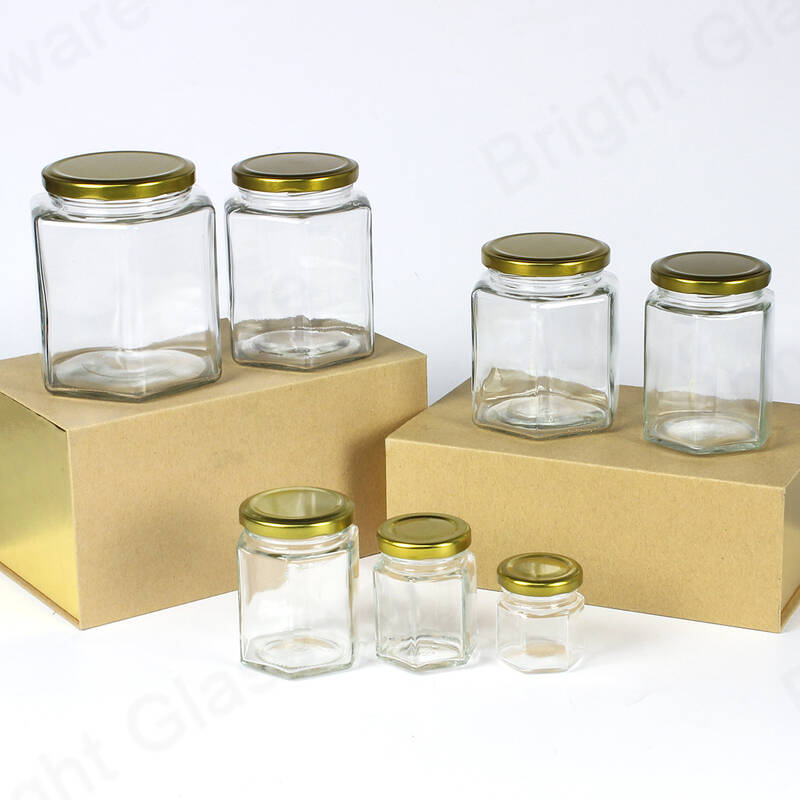 Chine Fournisseur Pot de miel en verre hexagonal bon marché avec couvercle à vis