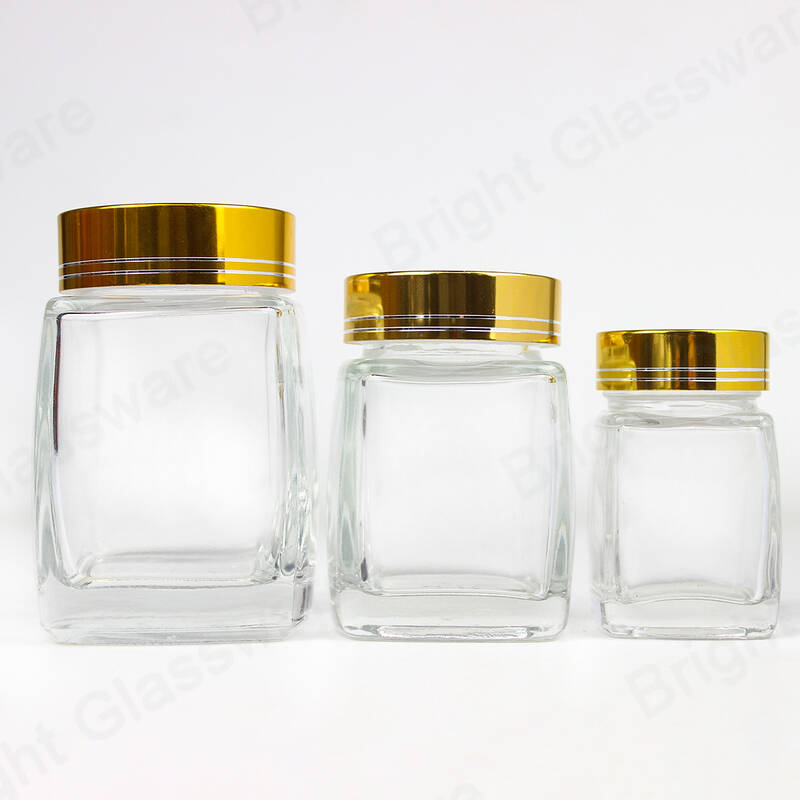 50ml 100ml 200ml Forme carrée Spice Glass Jar Vide Pots de miel en gros avec bouchon or / argent