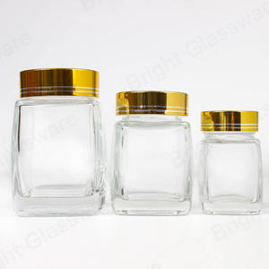 50ml 100ml 200ml cuadrado forma cuadrada tarro de vidrio de especias frascos de miel vacíos al por mayor con tapa de oro / plata