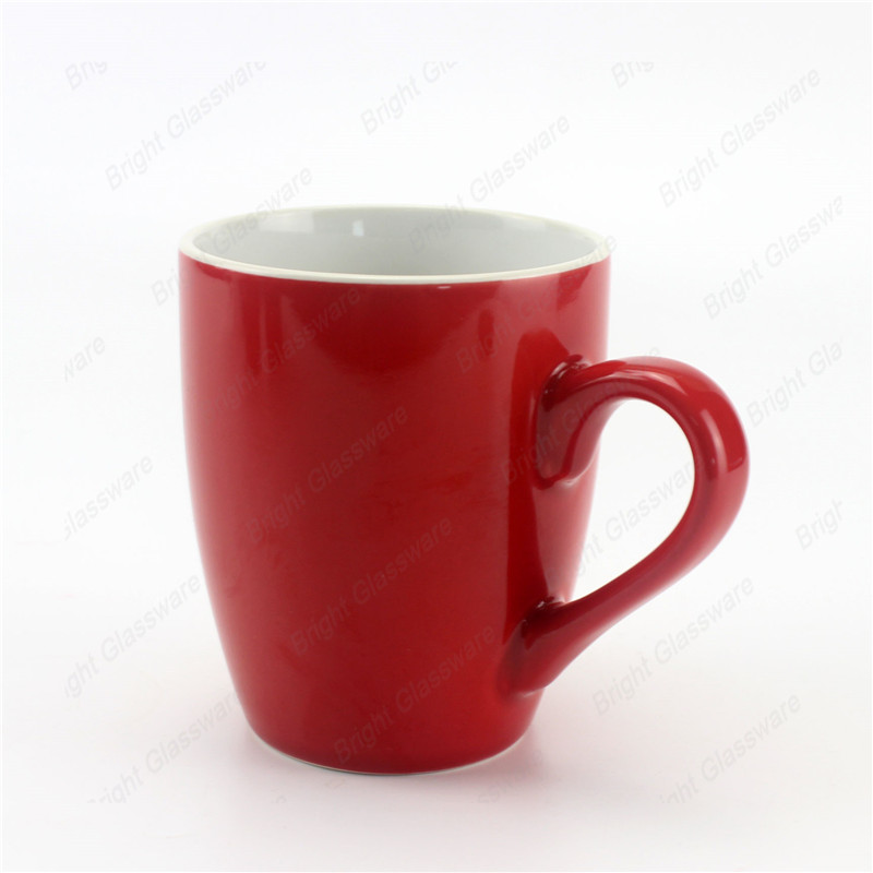 Suministro de fábrica al por mayor taza de café taza de cerámica roja con asa