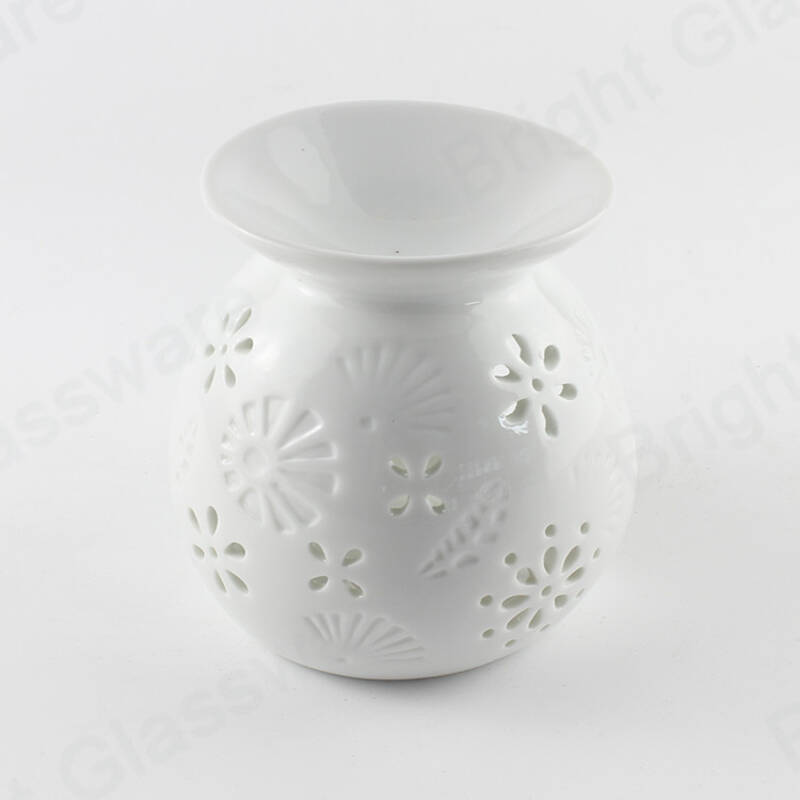 modern hollow out flower design white ceramic oil burner for aromatherapy wholesale