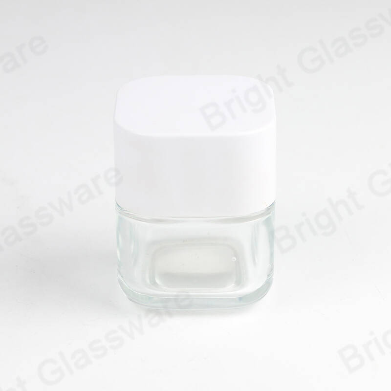 Vente en gros de pots cosmétiques en verre carré transparent avec couvercle blanc