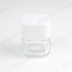 al por mayor frascos cosméticos de vidrio cuadrado transparente con tapa blanca