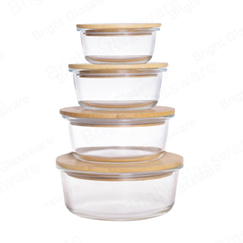 شكل دائري صندوق حفظ الزجاج المقاوم للحرارة حاوية طعام زجاجية من البورسليكات مع غطاء خشبي