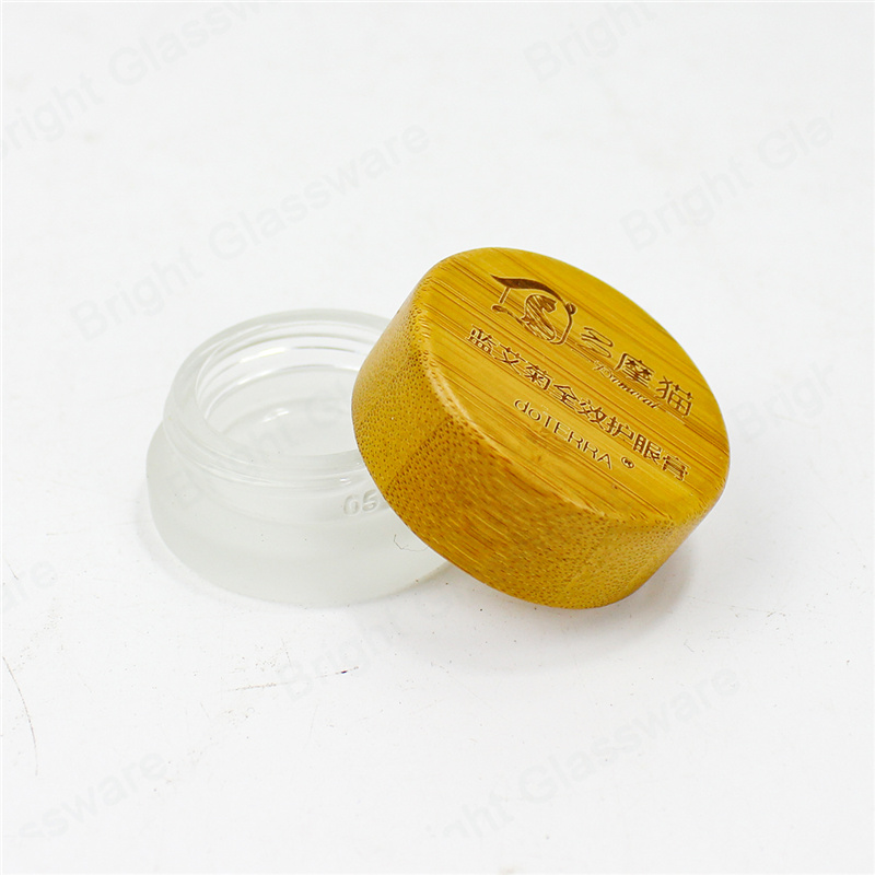 Venta al por mayor de recipiente cosmético de vidrio vacío frasco de crema de vidrio esmerilado con tapa de bambú