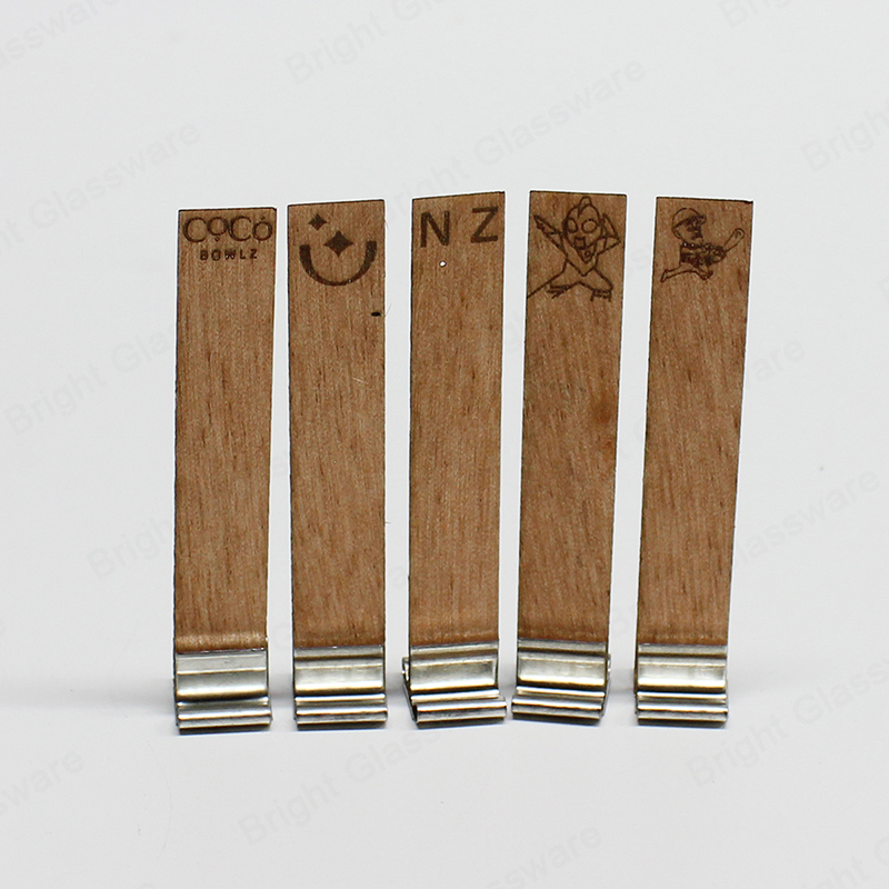 Engrosado logotipo personalizado respetuoso con el medio ambiente mechas de velas de madera sin humo con soporte de hierro