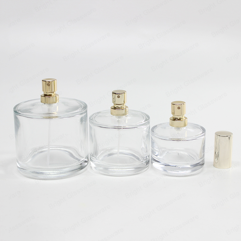 Alta calidad 30ml 50ml 100ml vidrio redondo vacío botella de perfume con cabeza de pulverización de oro