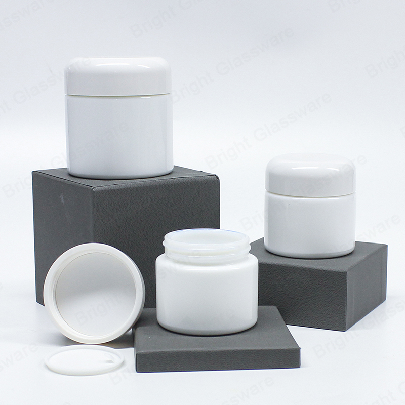 Frasco de crema de cosméticos de cilindro de vidrio blanco de alta calidad con tapa curva de rosca