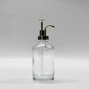 Muestra gratuita 500ml Luxury Pump Shampoo Bottle Glass Lotion Bottle con bomba de metal