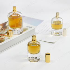 2022 New Luxury Round Bottom Volcanic Stone Glass Perfume Bottle With Custom Lid